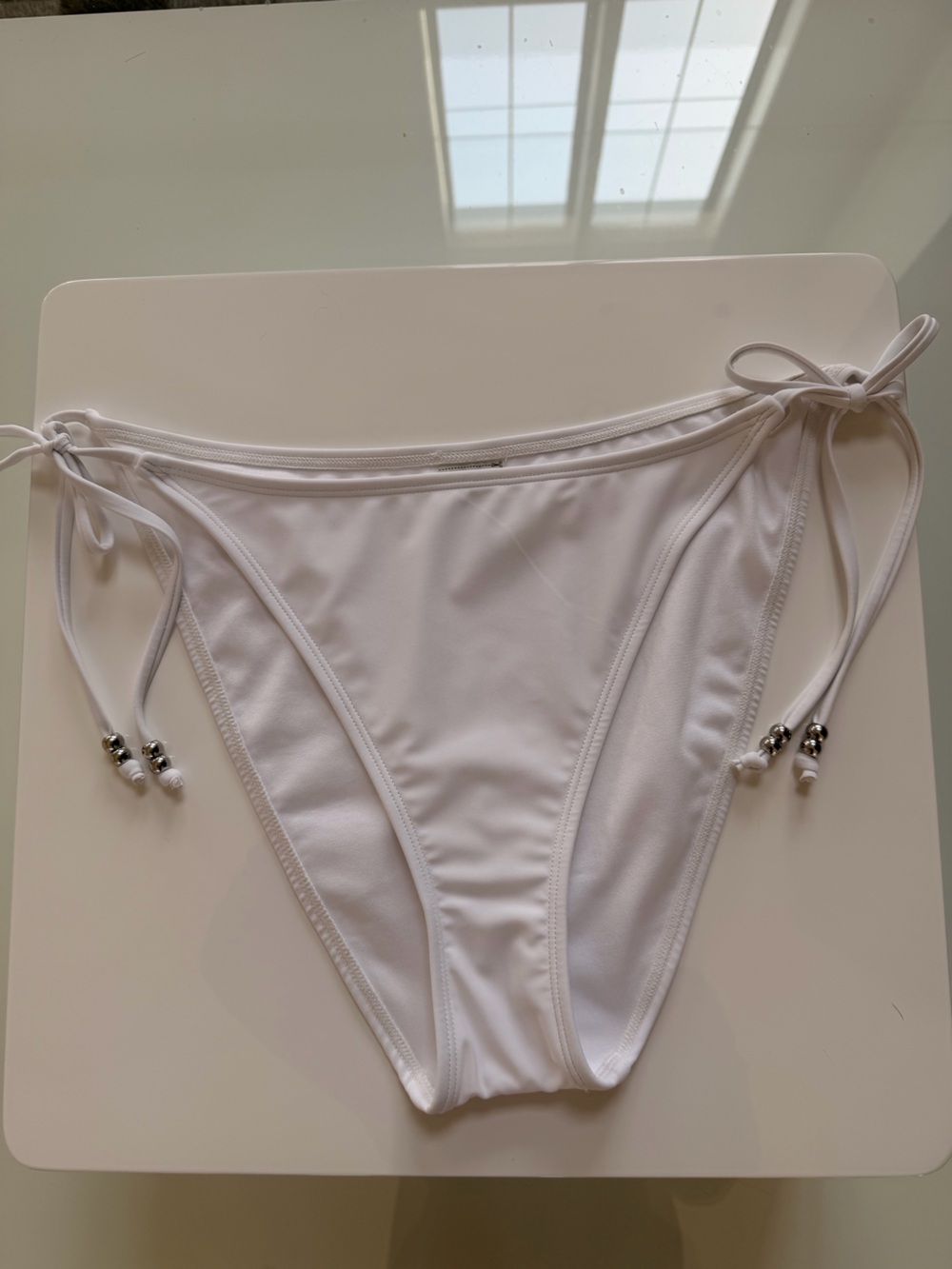 No Boundaries White Tie-Side Bikini Bottoms with Bead Accents
